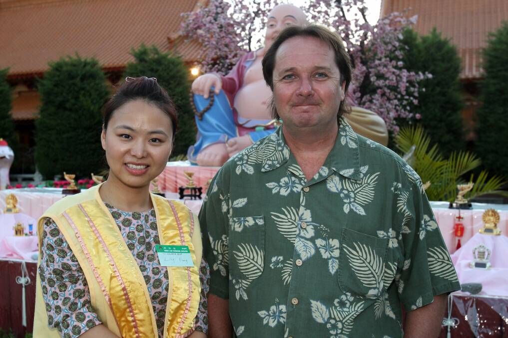 Lily Feng and Jim Flynn at Nan Tien Temple. Picture: GREG TOTMAN