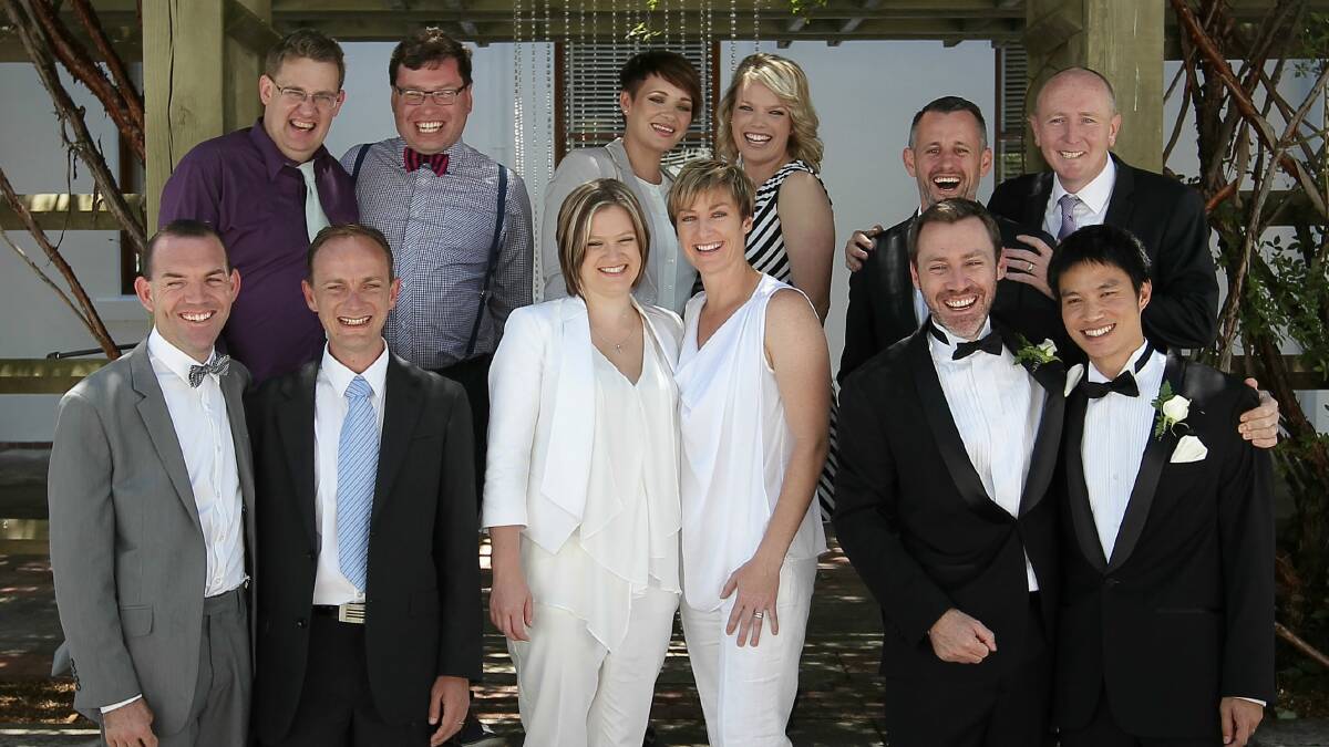 Six of the same-sex couples who got married in the ACT pose for a group photo at Old Parliament House. Photo: Alex Ellinghausen 
