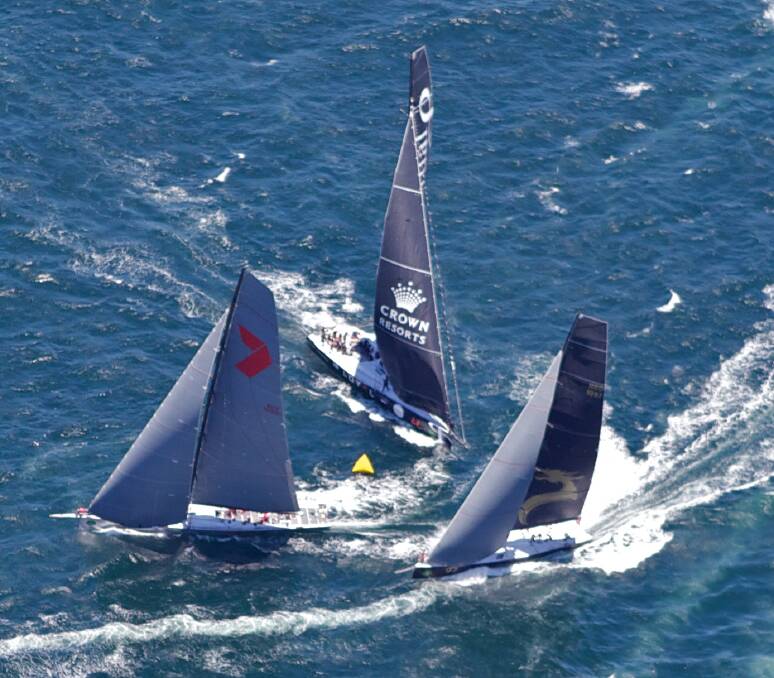 Wild Oates leads first around the marker with Beau Geste and Loyal at the start of the Sydney to Hobart race. Picture BRENDAN ESPOSITO