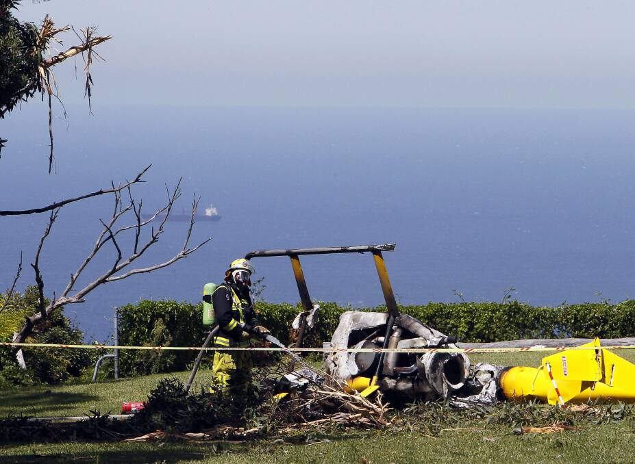 The helicopter crash at Panorama House in Bulli Tops in March. Picture ANDY ZAKELI