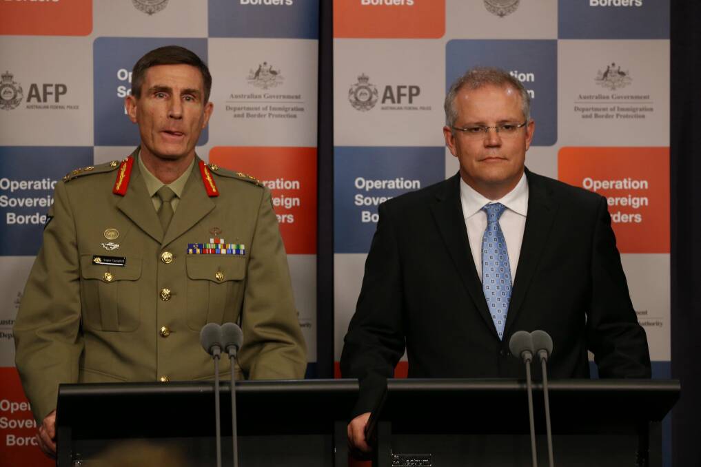 Lieutenant-General Angus Campbell and Immigration minister Scott Morrison. Picture ANDREW MEARES