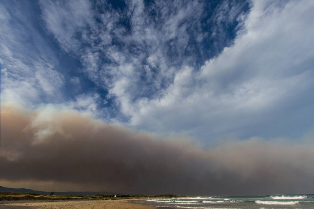 Smoke over Towradgi Beach. PICTURE: Chris Edmond