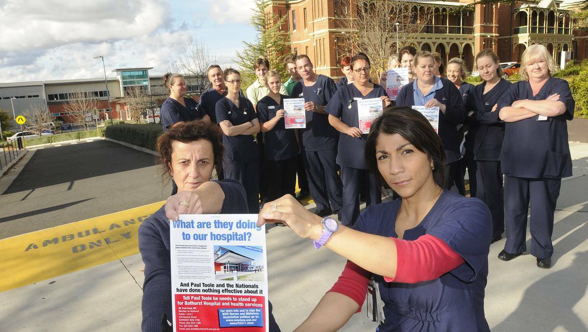 BATHURST: NSW Nurses and Midwives Association Bathurst branch members Lyn Sloane and Tatiana Muller (front) and their nursing colleagues are fighting planned cuts at Bathurst Base Hospital. Photo: CHRIS SEABROOK (WESTERN ADVOCATE) 