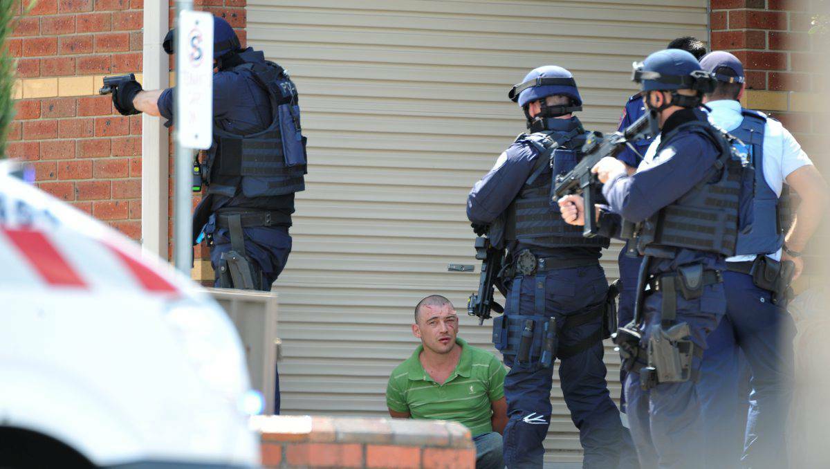 Police surround Scott Pearce, 25, at the end of a five-hour siege in March this year. PICTURE: THE COURIER. 