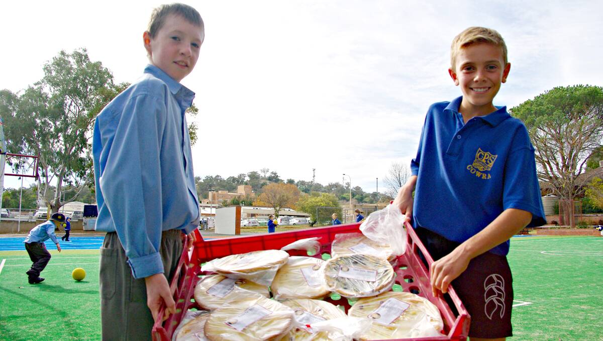 COWRA: Cowra Public School has been busy fundraising for year’s five and six excursion later this year- almost 1000 pies later and they've finally reached their target. Luke D'Elboux and Brodie Graham help sort the huge pie order. 