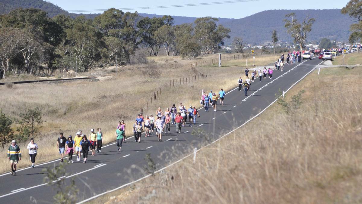 LITHGOW: Pipers Flat Road turned into a footpath for walkers in the Walk for Cancer fundraiser held on Sunday. 