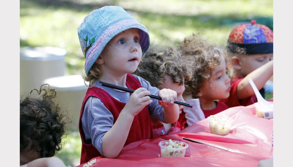 Two-year-old Summer Nisbet tries some fried rice. Photos: ANDY ZAKELI 