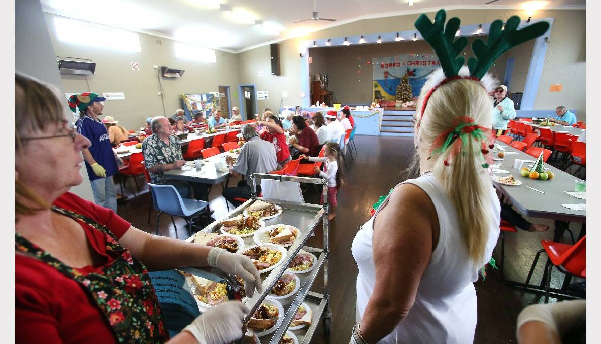 Volunteers hard at work at the Warrawong Community Centre Christmas lunch. PICTURE: KIRK GILMOUR
