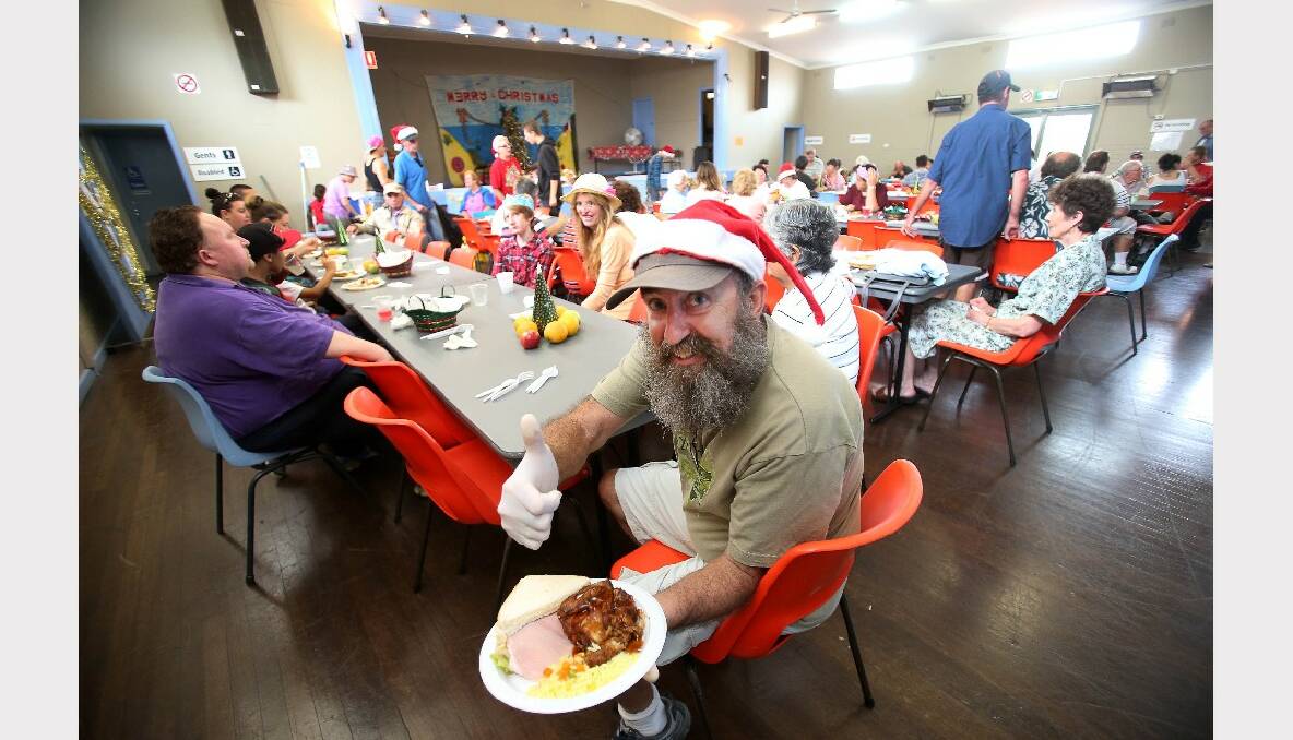 Thumbs up for the Warrawong Community Centre Christmas lunch. PICTURE: KIRK GILMOUR