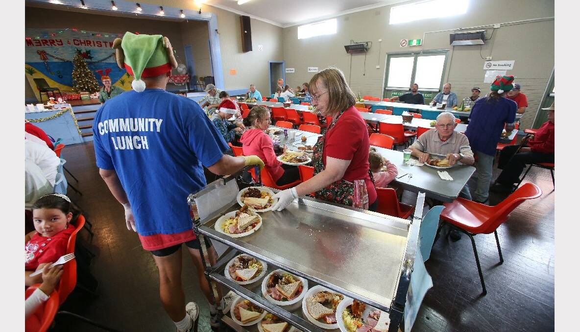 Volunteers hard at work at the Warrawong Community Centre Christmas lunch. PICTURE: KIRK GILMOUR