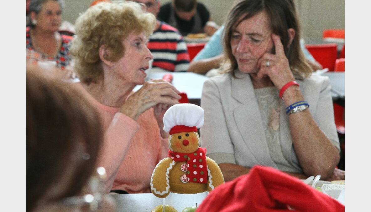 A Christmas conversation at the Warrawong Community Centre Christmas lunch. PICTURE: KIRK GILMOUR