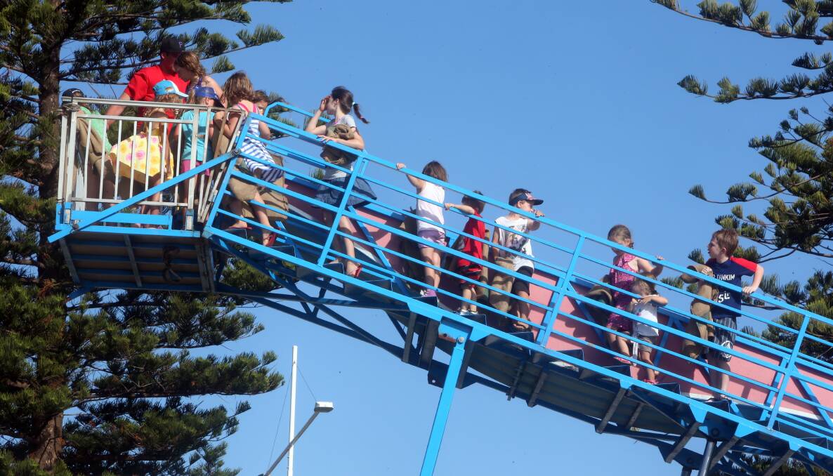 Lining up for the giant slide. Picture: ROBERT PEET