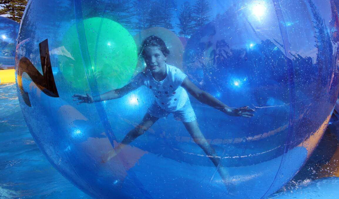 Smezana Dedovic, 10, from Wollongong in a giant water balloon.Picture: ROBERT PEET
