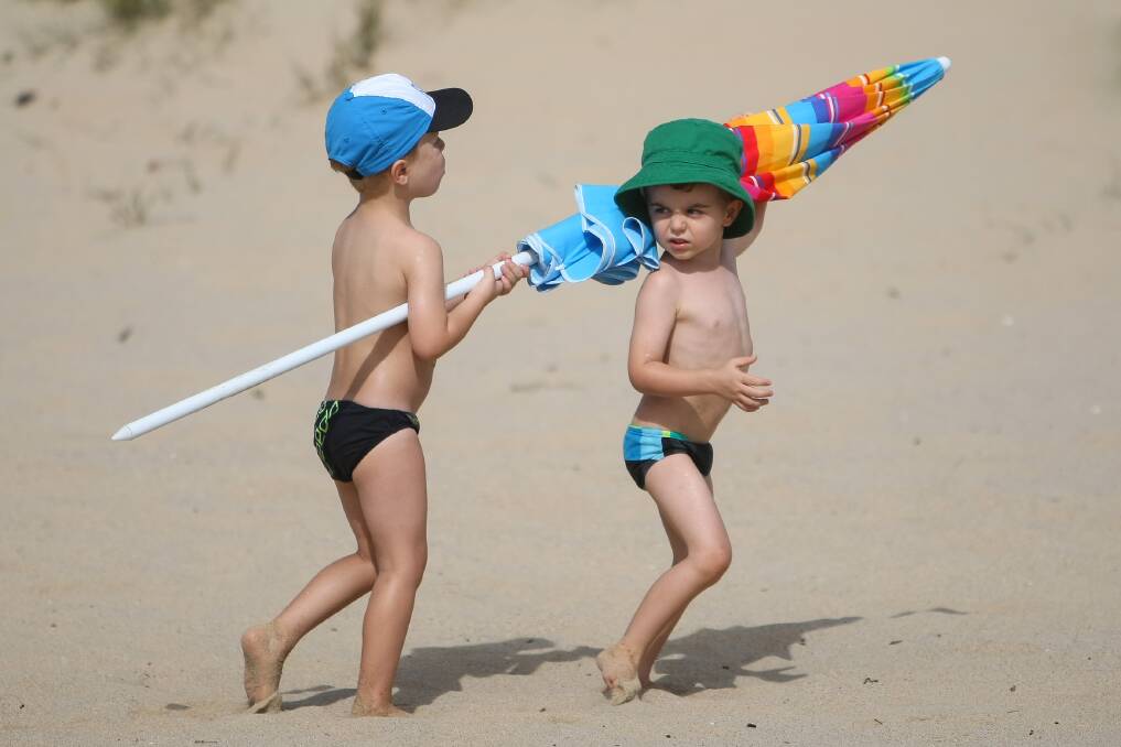 Sydney boys Angus Blake and Oliver Moufarrige on Jones Beach celebrating Australia Day. Pictures: Dylan Robinson