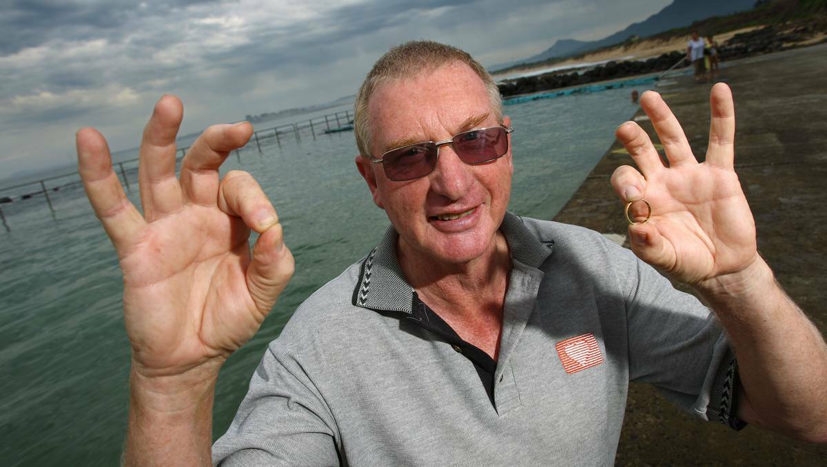 A delighted Reg McFarlane at Towradgi Pool with his boomerang jewellery item. Photo: Ken Robertson