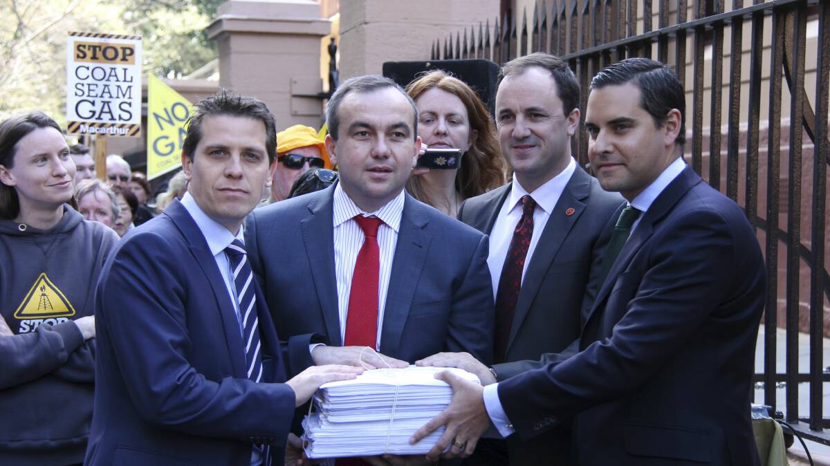 NSW politicians Ryan Park, Jai Rowell, Jeremy Buckingham and Alex Greenwich receive the CSG petition. 