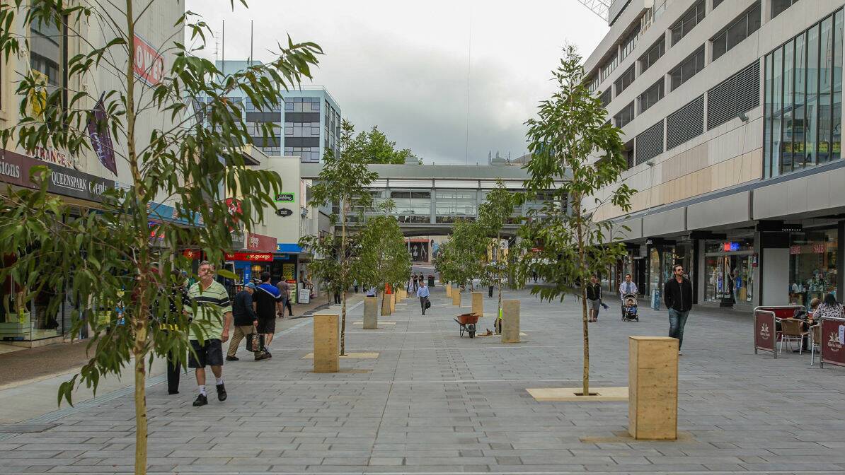  The western end of Crown Street Mall was reopened last week, with some criticising the planting of gum trees. Picture: CHRISTOPHER CHAN