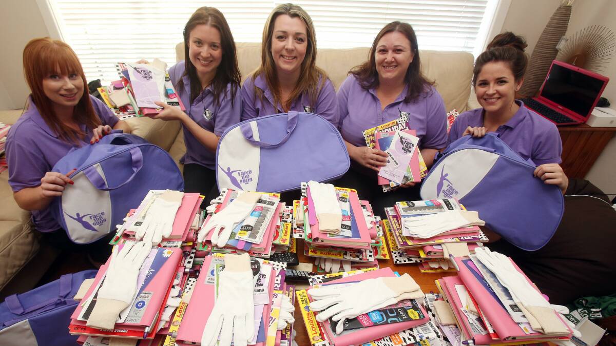  Raise the Gong members Sarah Zaremba (left), Haley Evans, Jacalyn Malone, Chelsea Cappetta and Erin Koens assemble the Chemo Care Kits for women undergoing chemotherapy. Picture: ROBERT PEET
