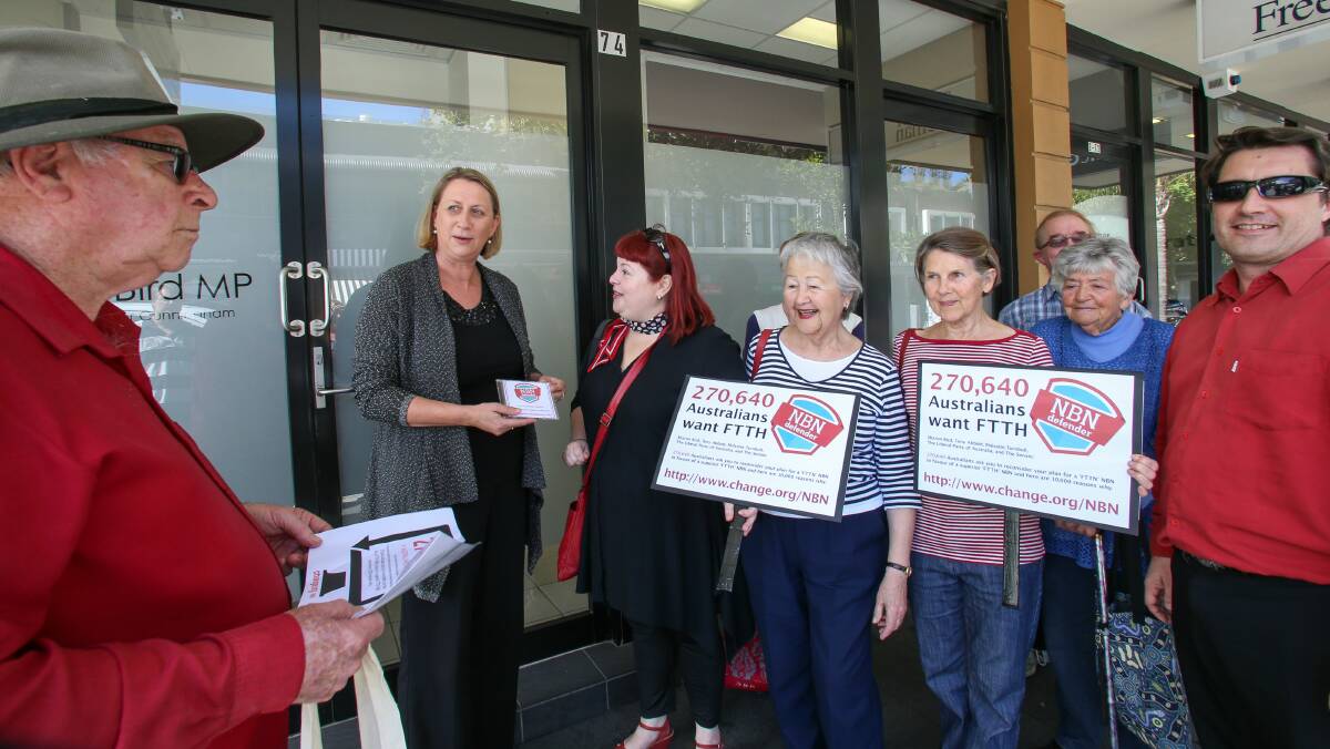  Supporters of the NBN fibre-to-the-home plan, including Neville Arrowsmith (left), Marina Varda (third from left) and her mum, Mariana, deliver the petition to Cunningham MP Sharon Bird. Picture: ADAM McLEAN