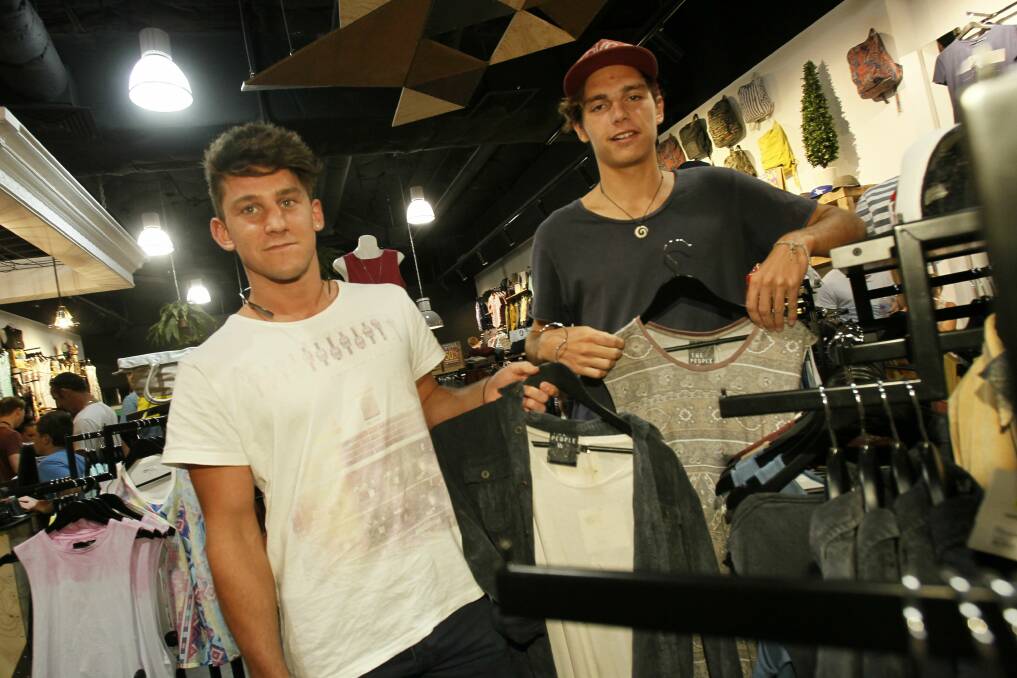 Jarryd Rook of Mt Warrigal and Jordan Rogers of Warilla shopping at Parliament Clothing. Pictures: DAVE TEASE