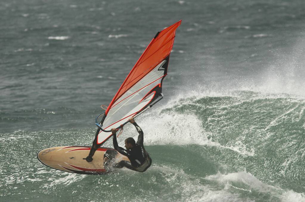 Wind surfers at Cowrie Island, Shellharbour. Picture: DAVE TEASE