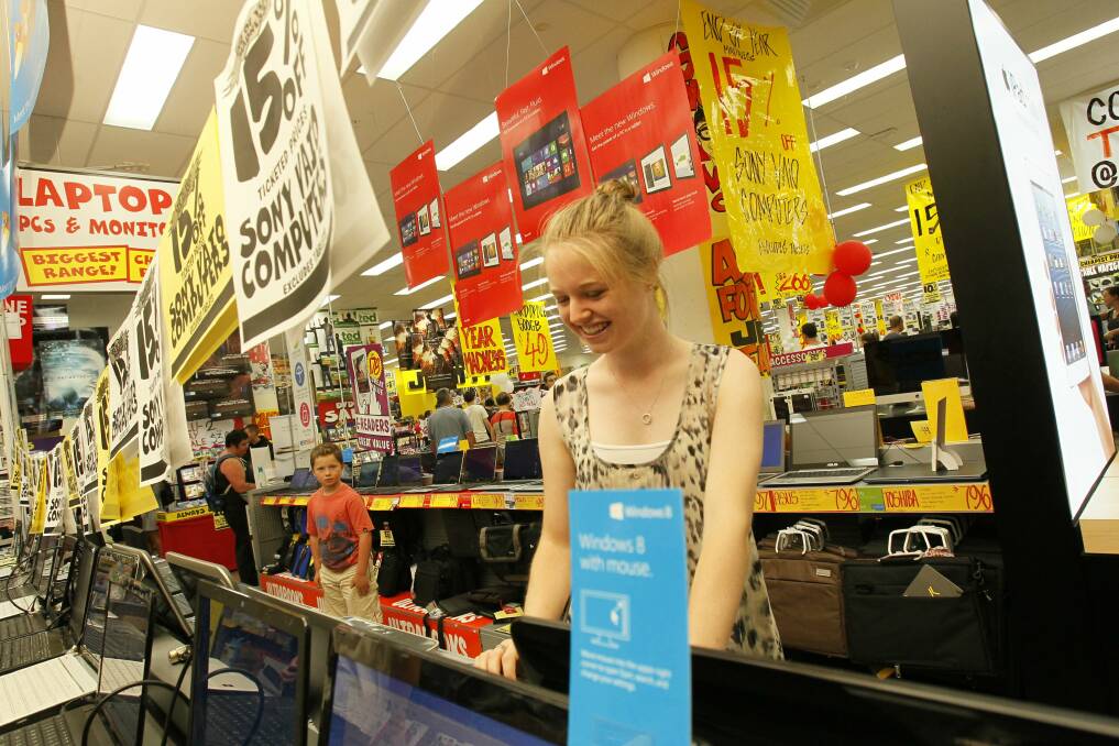 Sarah Duncan of Cordeaux Heights checking out the laptops at JB Hi-Fi. Pictures: DAVE TEASE
