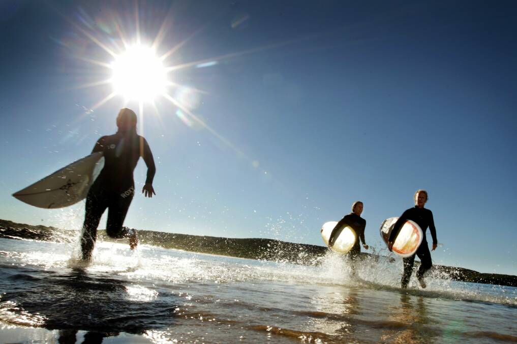 Surfers heading back to shore. Picture: SYLVIA LIBER