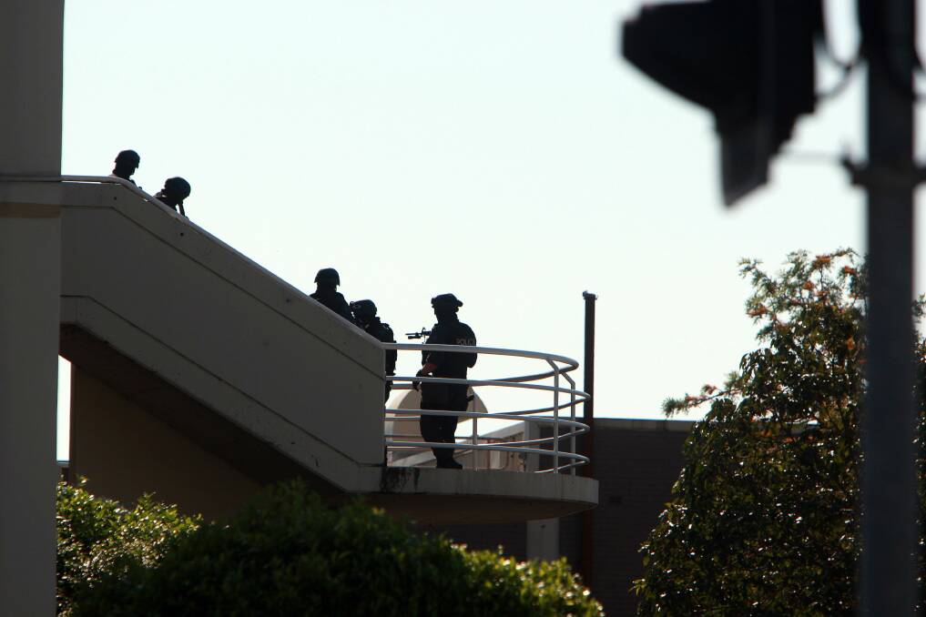 Police at a siege in Warrawong