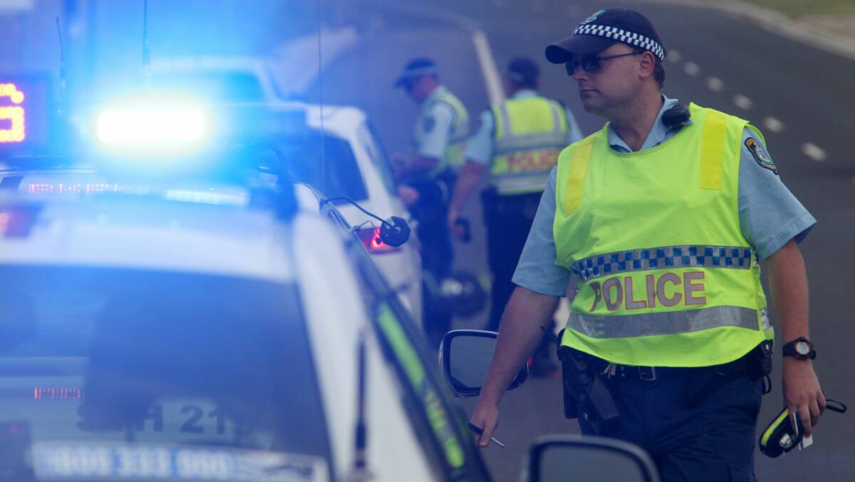 Lake Illawarra highway patrol officers conduct breath tests at Shell Cove on Monday. Picture: GREG TOTMAN