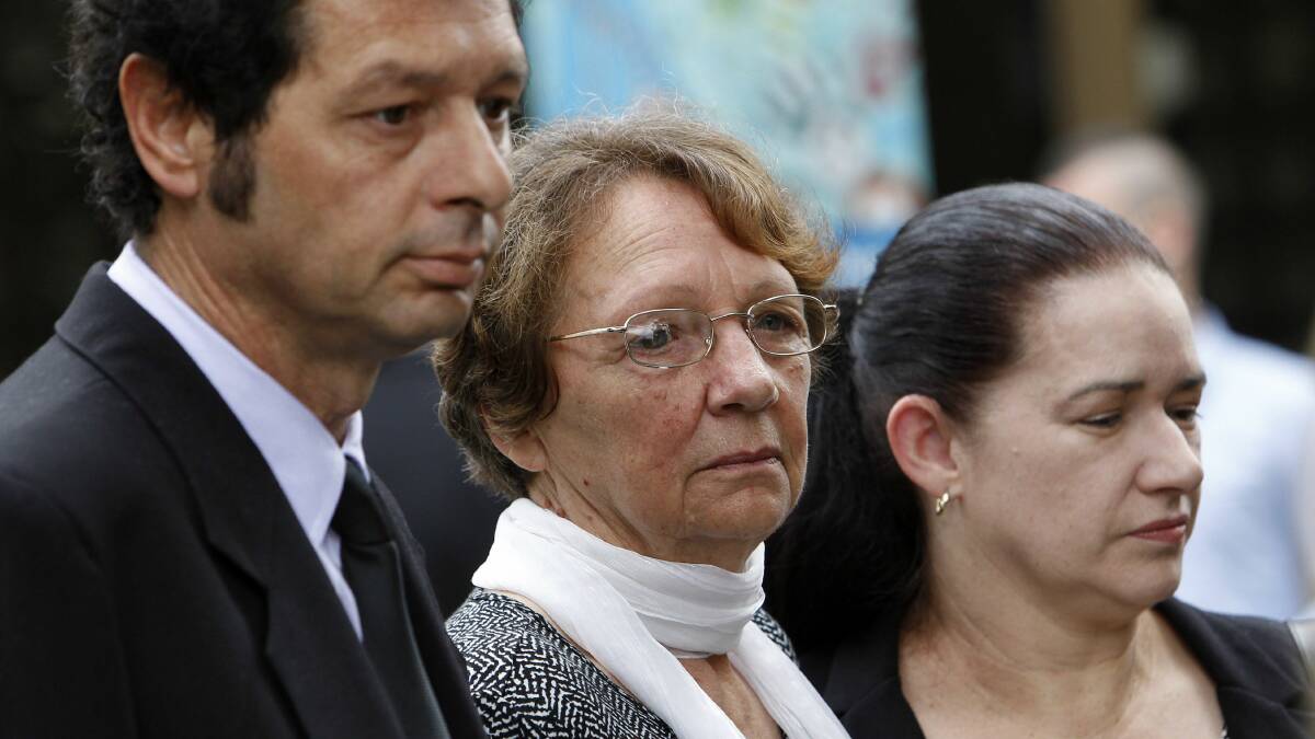 Beatriz Vega, centre, leaves the court with family members after the inquest into the accidental death in Wollongong Hospital of her husband, Ariel Vega, 78.