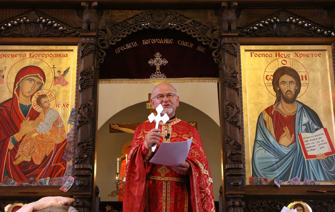 The Very Reverend Alexandar Ivanovski conducts mass. Picture: KIRK GILMOUR