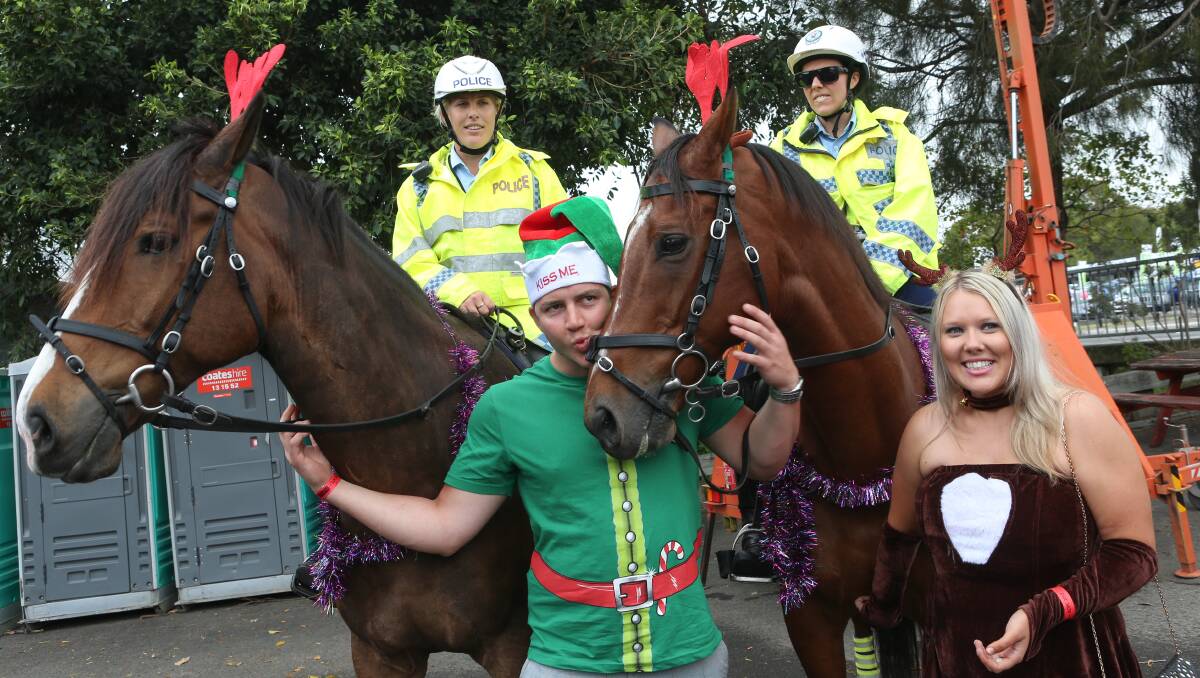 Ashley Zampa and Gavin Hayward with mounted police. Picture: ADAM McLEAN