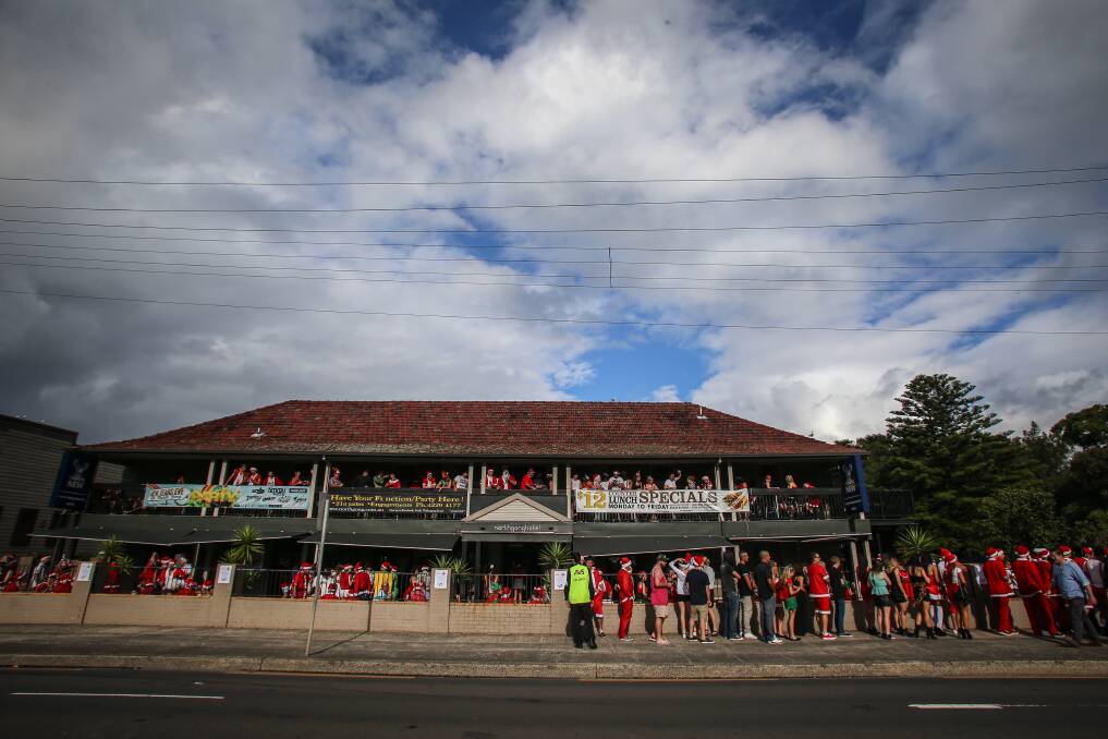 Revellers enjoy the start of the Santa Pub Crawl in Wollongong on Saturday. Picture: ADAM McLEAN