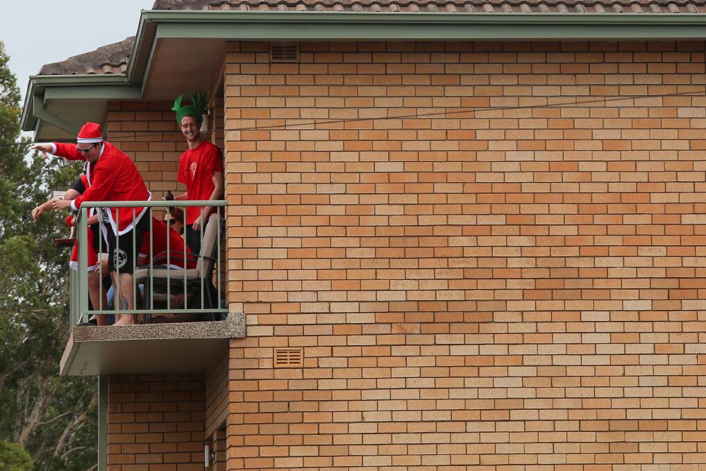 Revellers at an apartment block before the start of the pub crawl. Picture: ADAM McLEAN