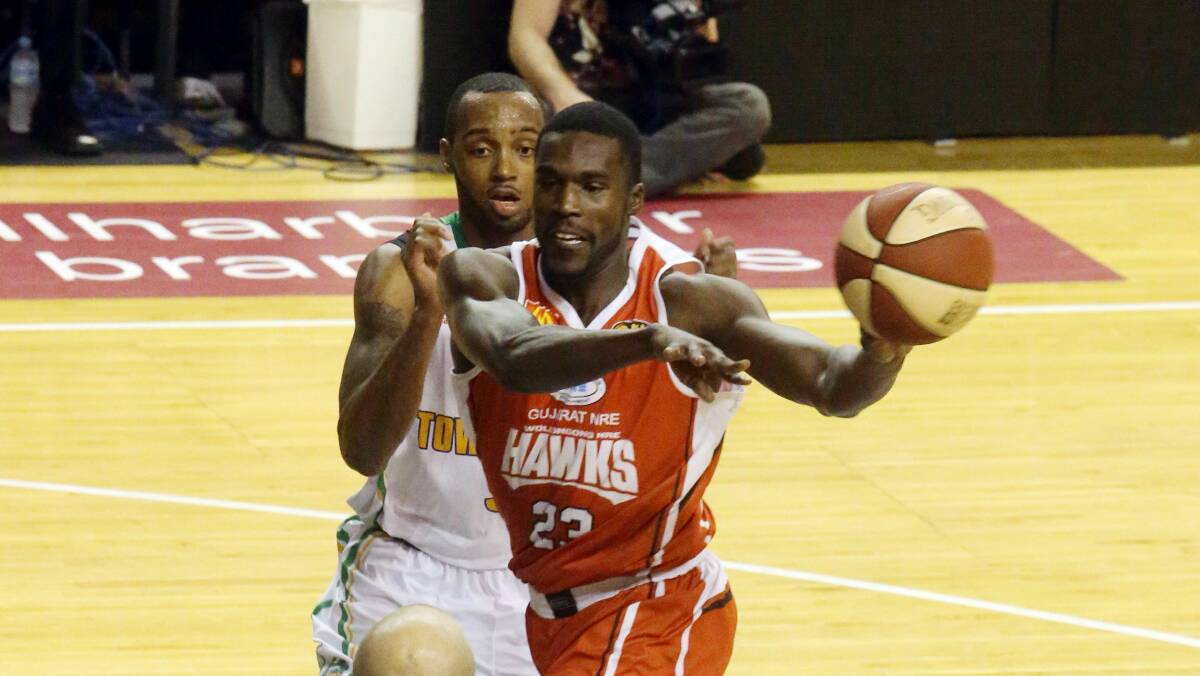 Kevin Tiggs drives to the basket during the first game of Wollongong’s winning weekend double against the Townsville Crocodiles on Friday night. Picture  ROBERT PEET
