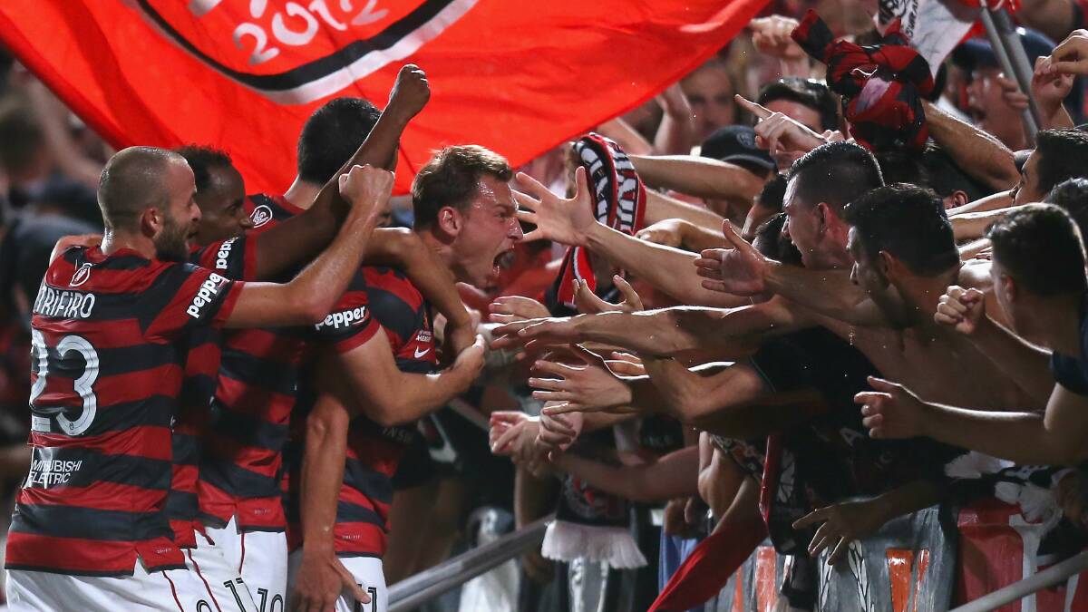 rendon Santalab of the Wanderers celebrates his goal with fans after scoring the winner from a Youssouf Hersi cross just before the full-time whistle.  GETTY IMAGES