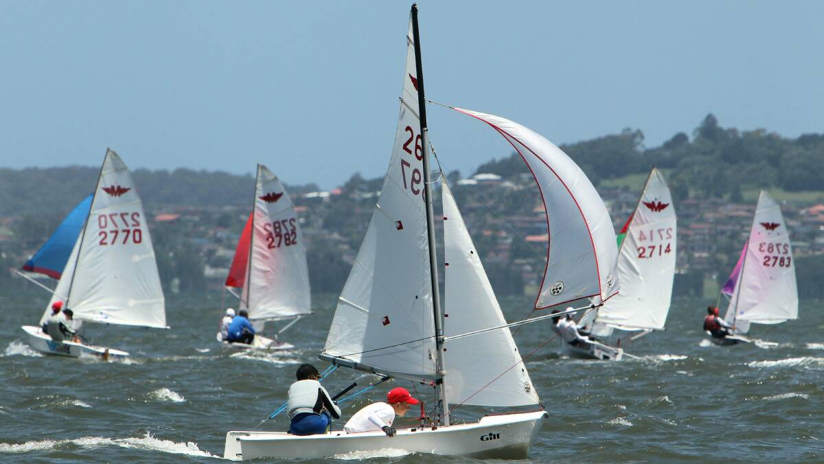 Racing was fierce during the final day of the Manly Junior national sailing championships on Lake Illawarra on Monday. Pictures: KIRK GILMOUR