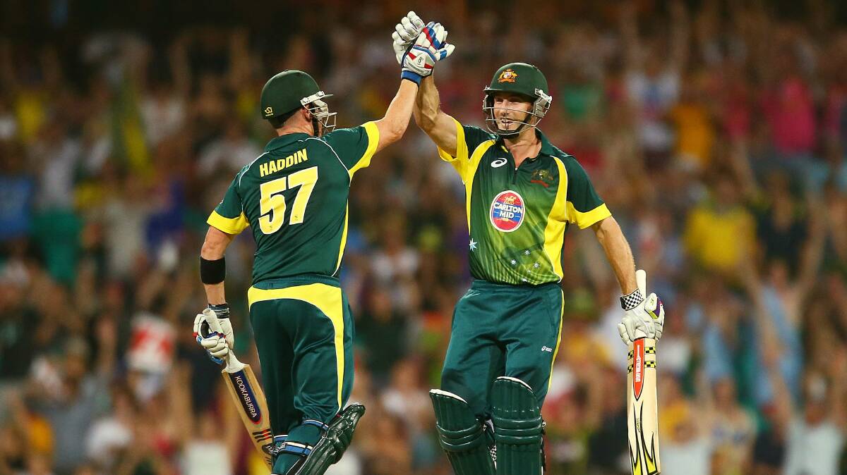 Brad Haddin and Shaun Marsh high five after Australia's victory over England last night. Picture: GETTY IMAGES