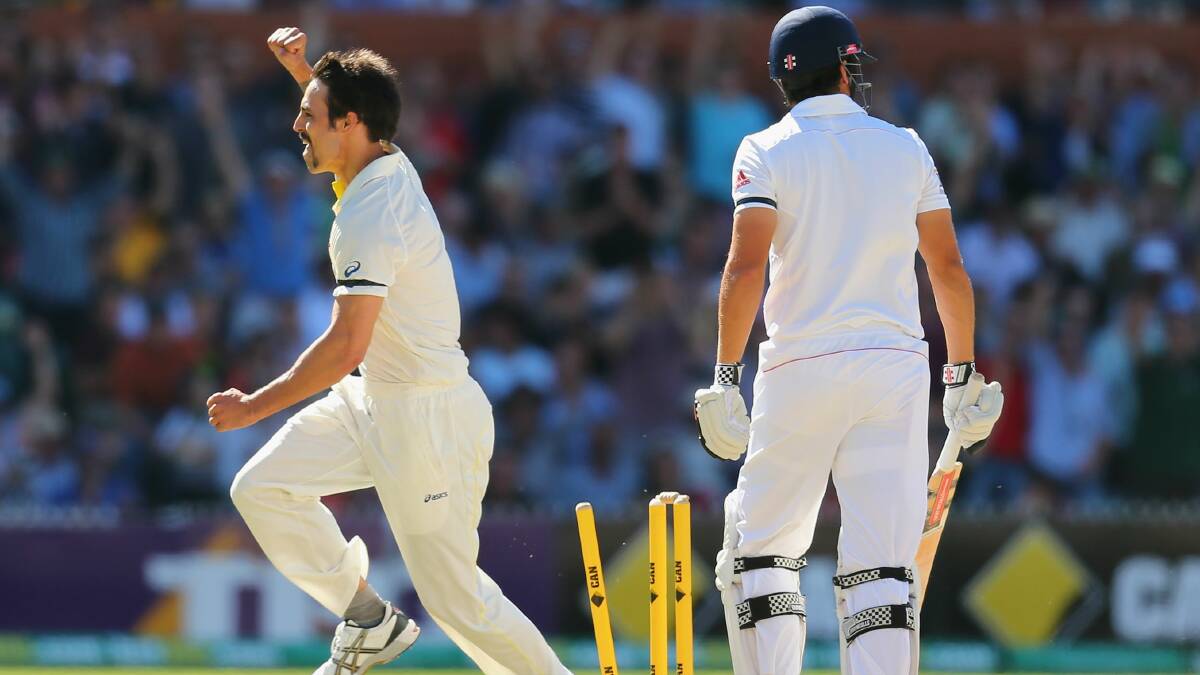 Mitchell Johnson celebrates taking England captain Alistair Cook's wicket. Picture: GETTY IMAGES