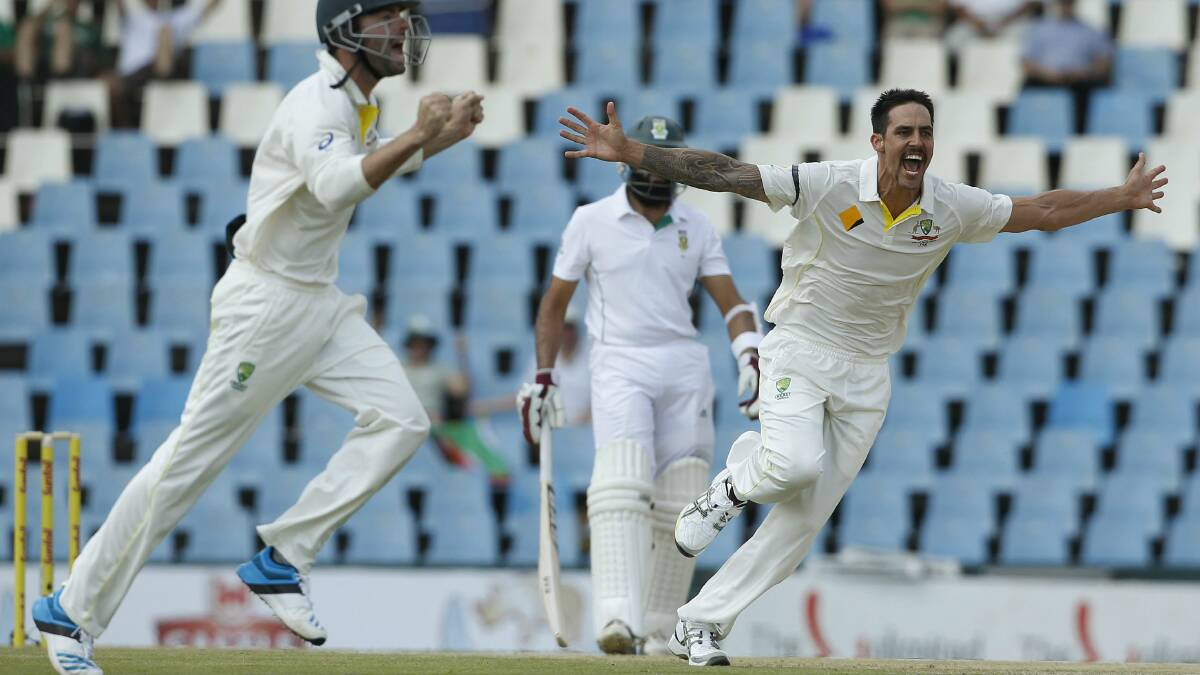 Mitchell Johnson celebrates taking the wicket of Faf Du Plessis. Picture: REUTERS