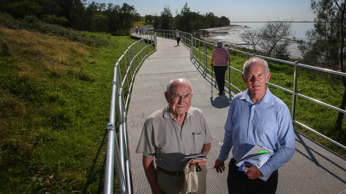Former Lake Illawarra Authority chairman Doug Prosser and executive officer Brian Dooley on the new boardwalk at Tallawarra which features in a new guide to Lake Illawarra's shareways. Picture ADAM McLEAN