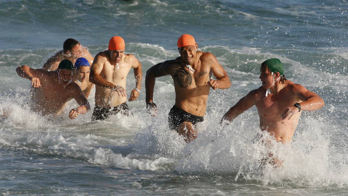 Waratahs players get in some training at Wollongong City Beach.