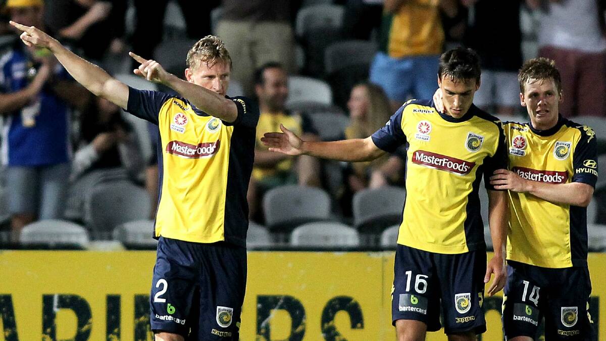 Central Coast’s Daniel McBreen, left, celebrates his goal against Sydney FC in their A-League match. Picture: GETTY IMAGES