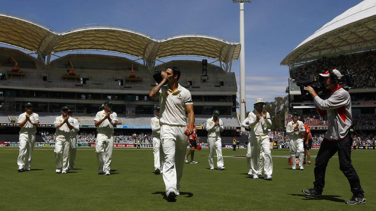 Australian fast bowler Mitchell Johnson leaves the Adelaide Oval after taking 7-40 in the Second Ashes Test against England. Picture: REUTERS