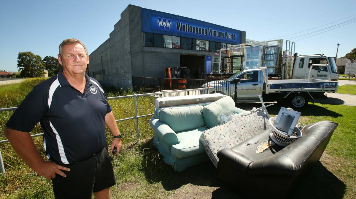 Paul Atkins is sick and tired of the front of Wollongong store Window World being used as a rubbish dump. Picture: KIRK GILMOUR
