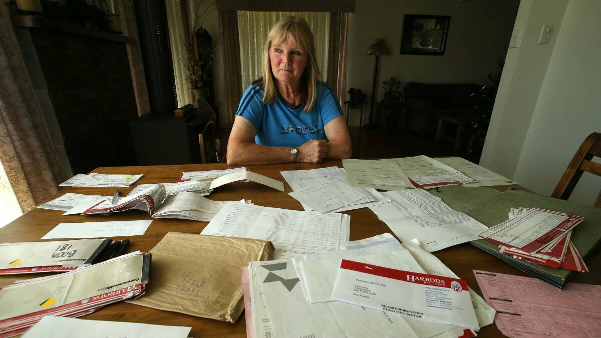 Carol Frank of Oak Flats has kept rental receipts dating back 10 years from Harrods Real Estate. Picture: KIRK GILMOUR