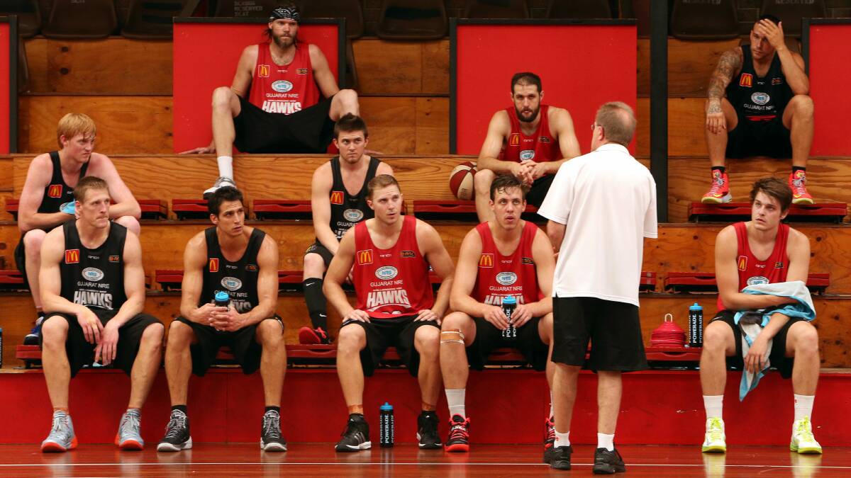 Hawks coach Gordie McLeod addresses the team at training yesterday. Picture: KIRK GILMOUR