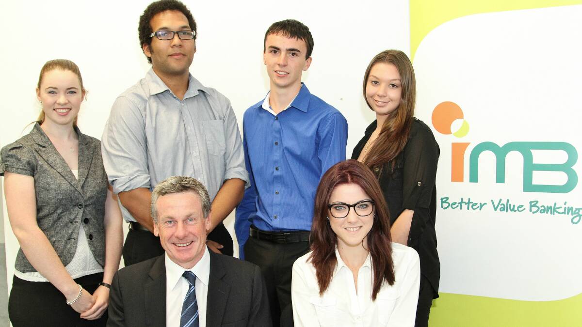 IMB trainees Holly Heffernan, Sherwin Williams, David Sawers, Rebecca Dove (back row), and Melanie Shepherd are welcomed to the building society by chief executive Robert Ryan.Picture: GREG ELLIS