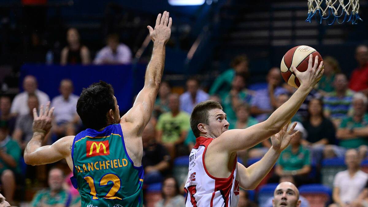 Hawks import Rotnei Clarke is shadowed by the Crocs' Todd Blanchfield during Friday night's game. Picture: GETTY IMAGES
