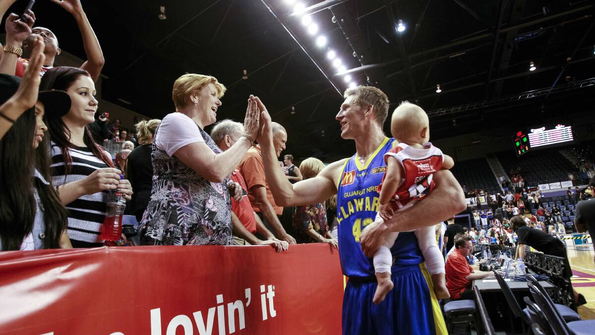 Dave Gruber greets fans after the Hawks' win over the Breakers on Friday night. Picture: CHRISTOPHER CHAN